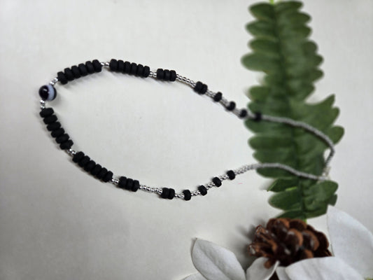 Shadow Tone Necklace with black polymer rings, silver beads and a striped center bead, view 2