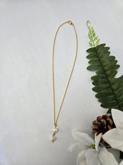 Soft Elegance Necklace with two pearls in a drop design on a gold-tone chain, view 3