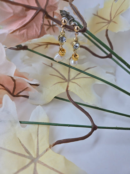 Elegant Shine Earrings with freshwater pearl drops under clear stones on gold-plated findings