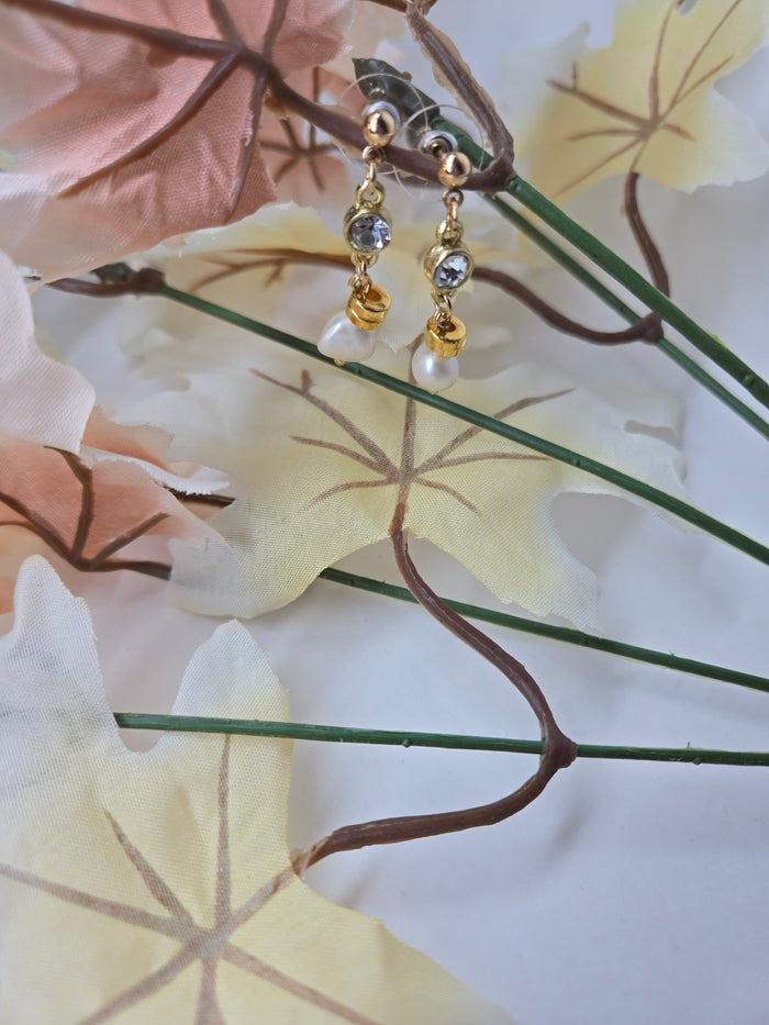 Elegant Shine Earrings with freshwater pearl drops under clear stones on gold-plated findings