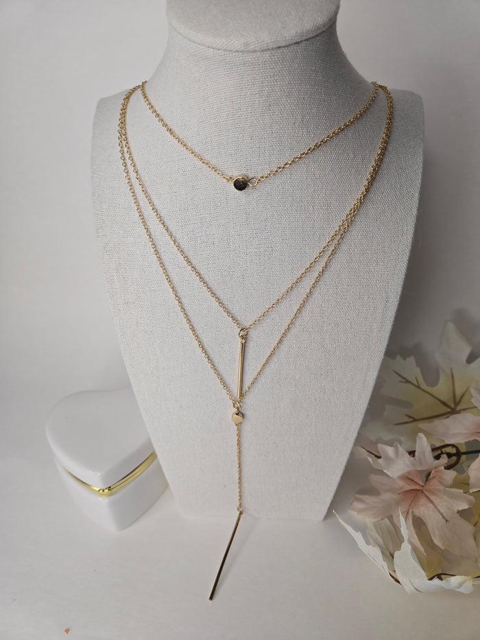 Soft Radiance Necklace with three gold-tone layers, a centerpiece and drop chains