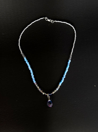 Blue Teardrop Necklace with clear-to-blue glass beads and a blue-violet teardrop pendant, view 2