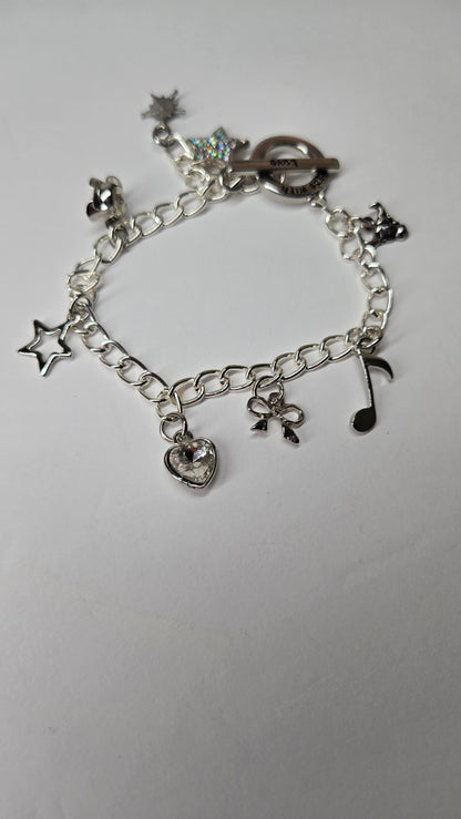 Silver Melody Charm Bracelet with star, bow, heart and musical note charms