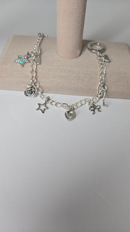Silver Melody Charm Bracelet with star, bow, heart and musical note charms, view 6