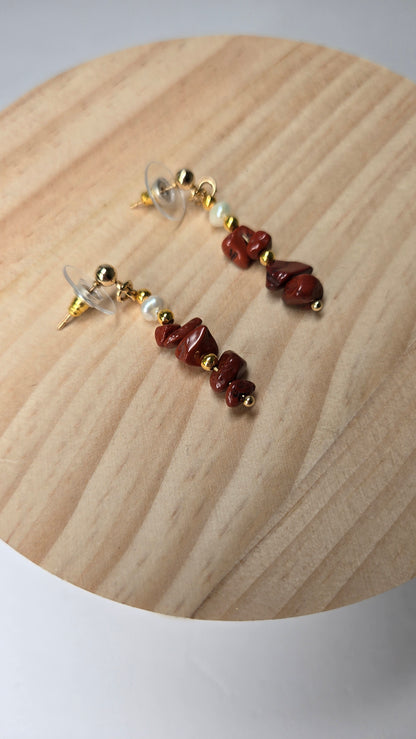 Crimson Coral Earrings with deep red coral stones, gold-tone accents and a pearl