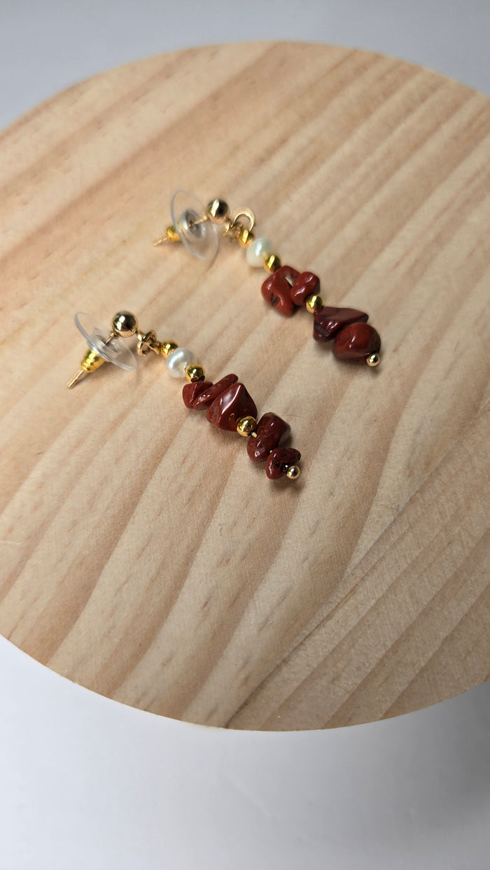 Crimson Coral Earrings with deep red coral stones, gold-tone accents and a pearl