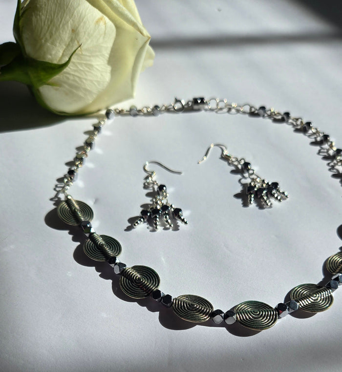 Moon Aura Gray Beaded Jewelry necklace with silver-tone spiral discs and matching earrings