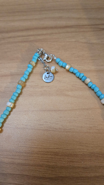 Sea Breeze Necklace with turquoise and ivory beads and silver details, view 3