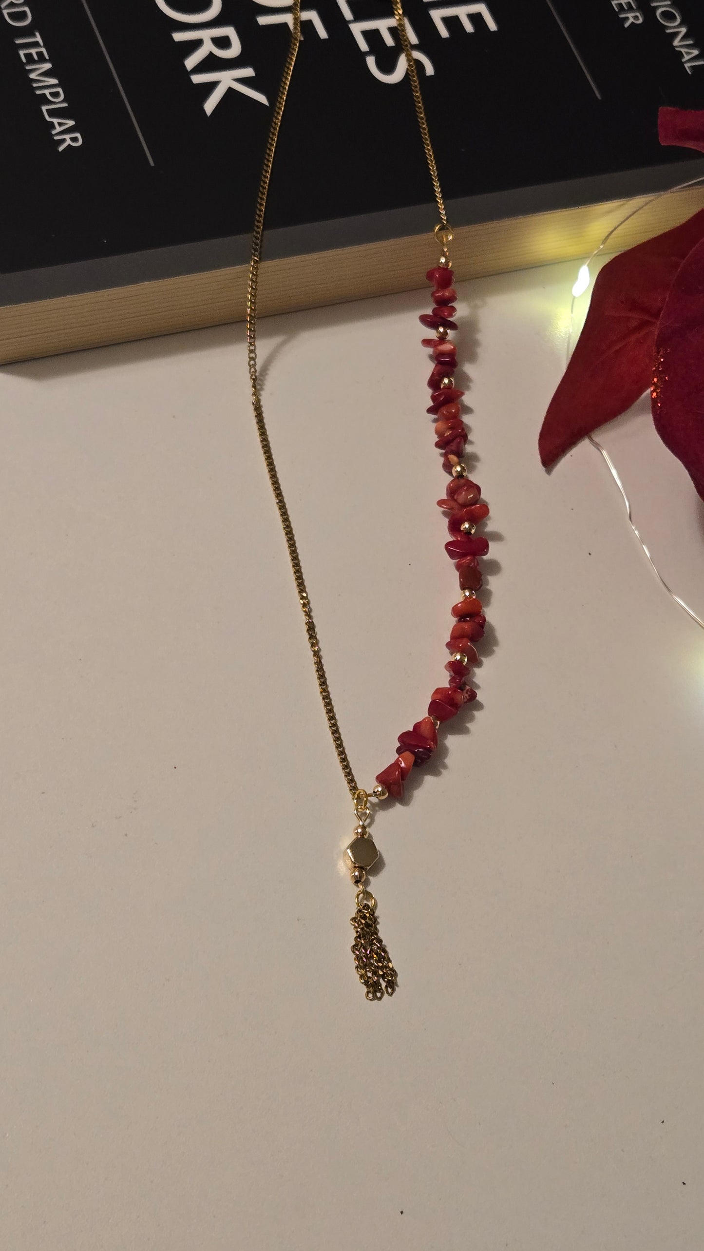 Detailed view of genuine crimson agate stones and delicate tassel