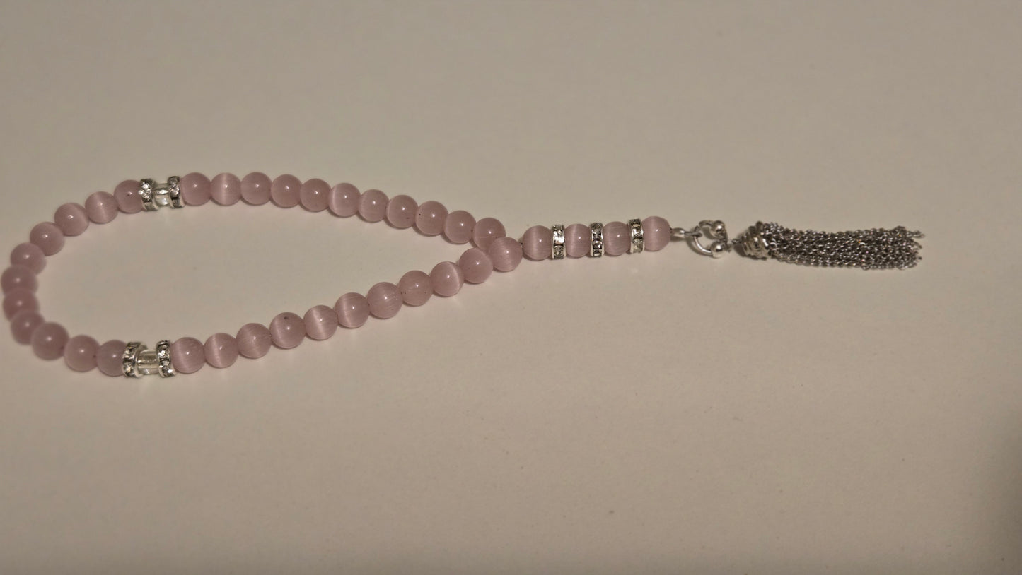 Blush Serenity Tasbih with soft pink beads and silver accents on a light background
