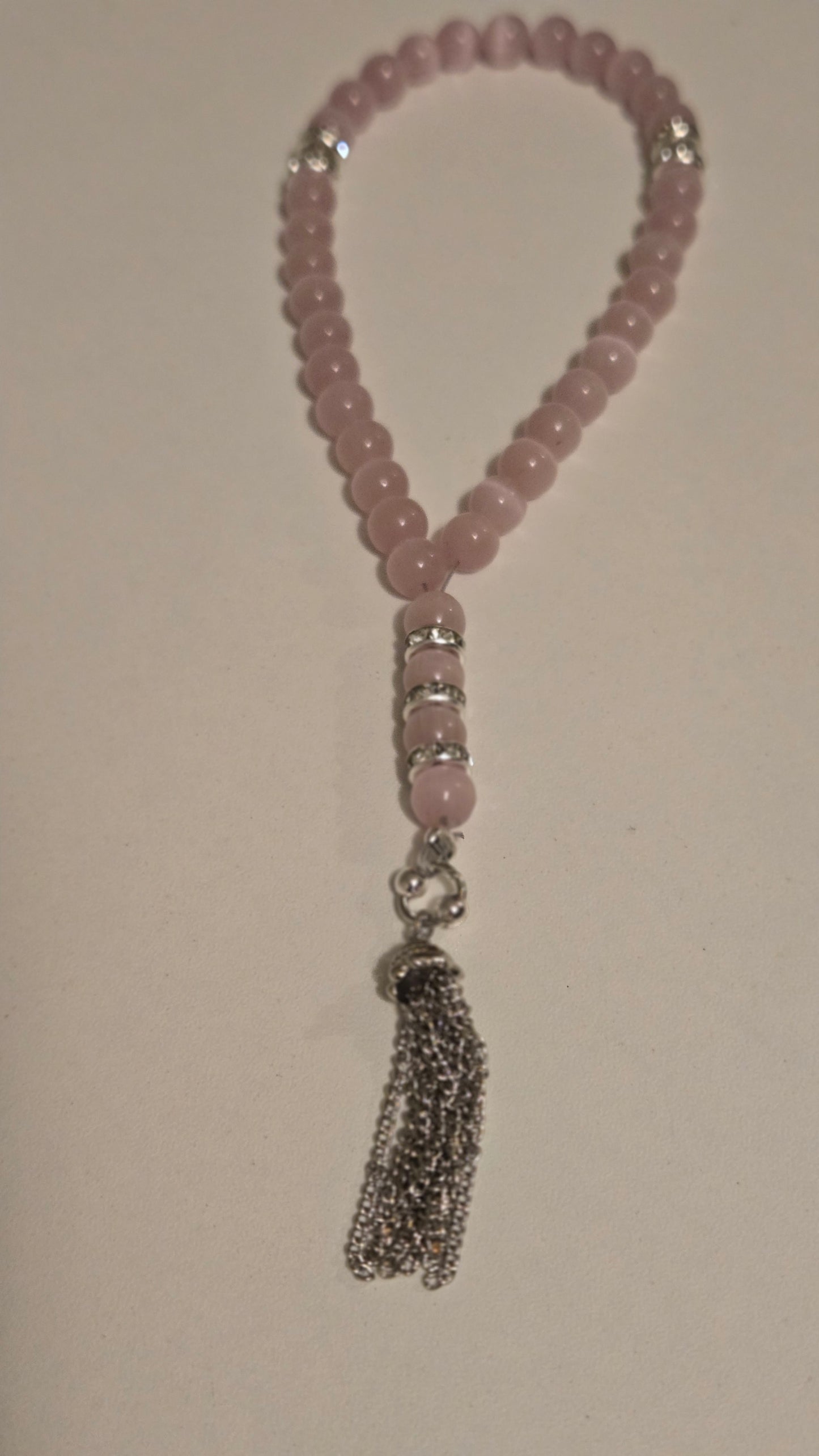 Elegant tasbih with a flowing tassel, showcasing its refined simplicity and craftsmanship