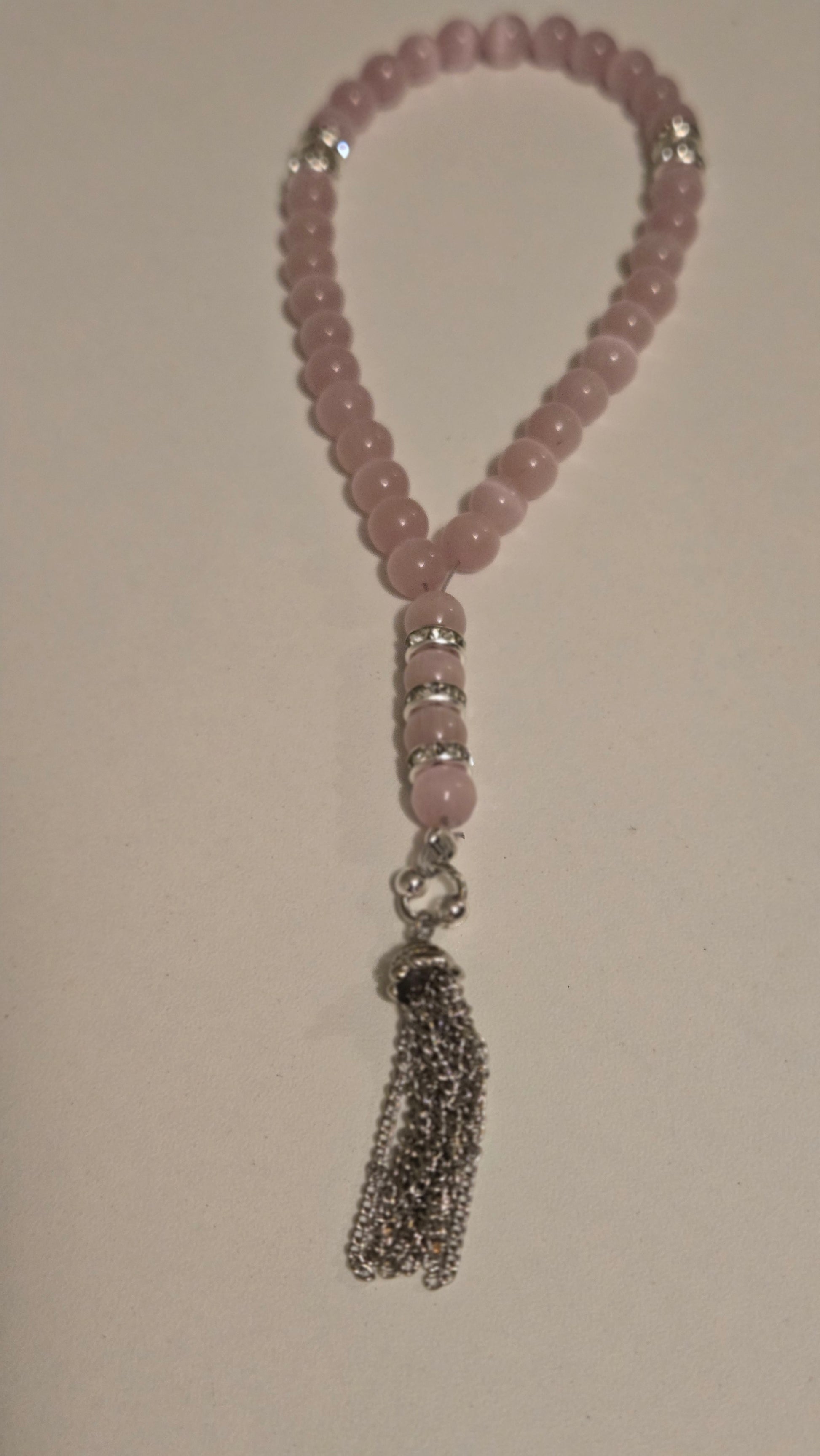 Elegant tasbih with a flowing tassel, showcasing its refined simplicity and craftsmanship