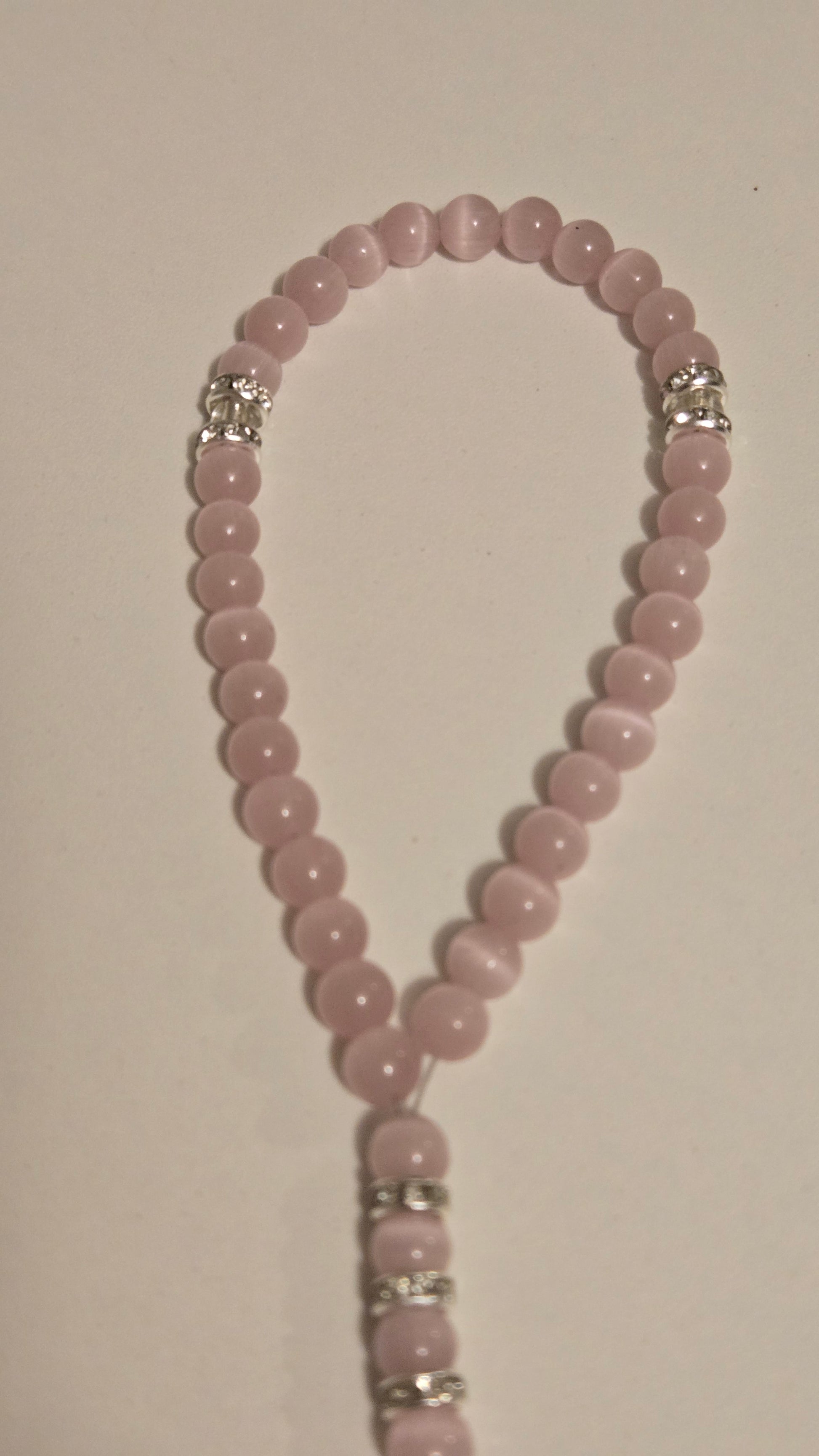 Unique handmade prayer beads, the Blush Serenity Tasbih, arranged beautifully as a gift