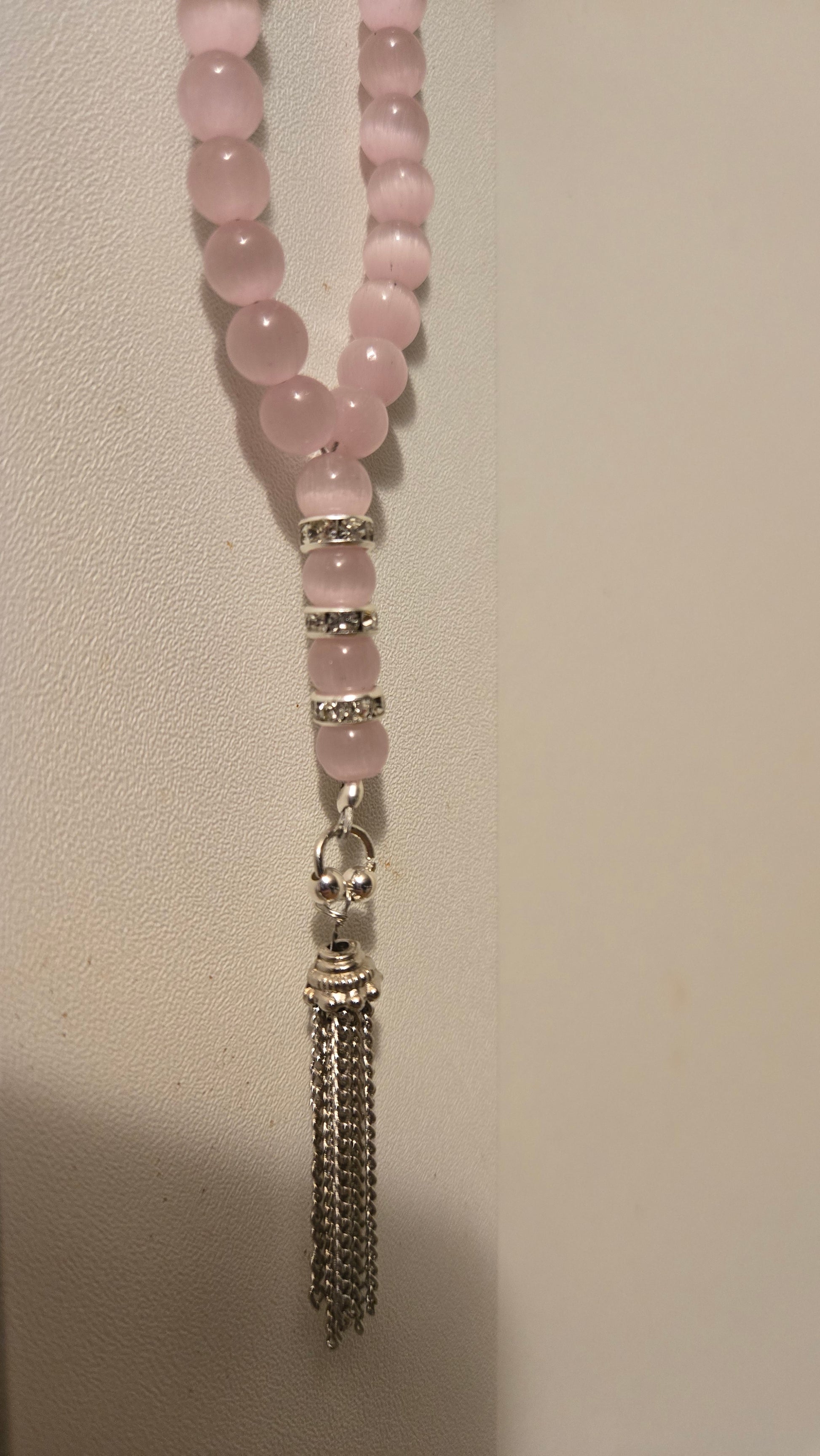 Blush Serenity Tasbih on a serene backdrop, evoking calm and spiritual reflection
