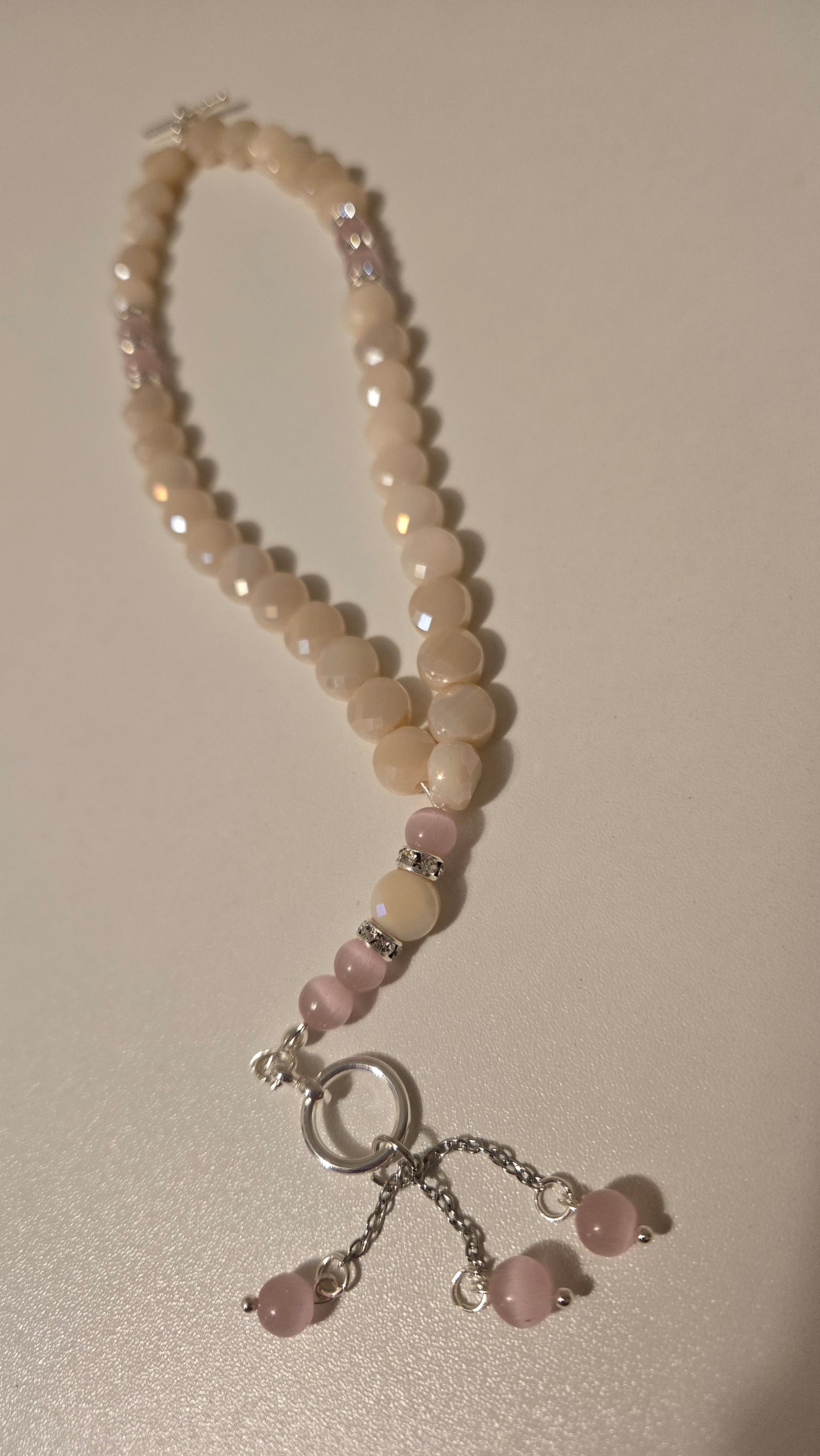 Rose Light Tasbih in a decorative pouch, ready for gifting