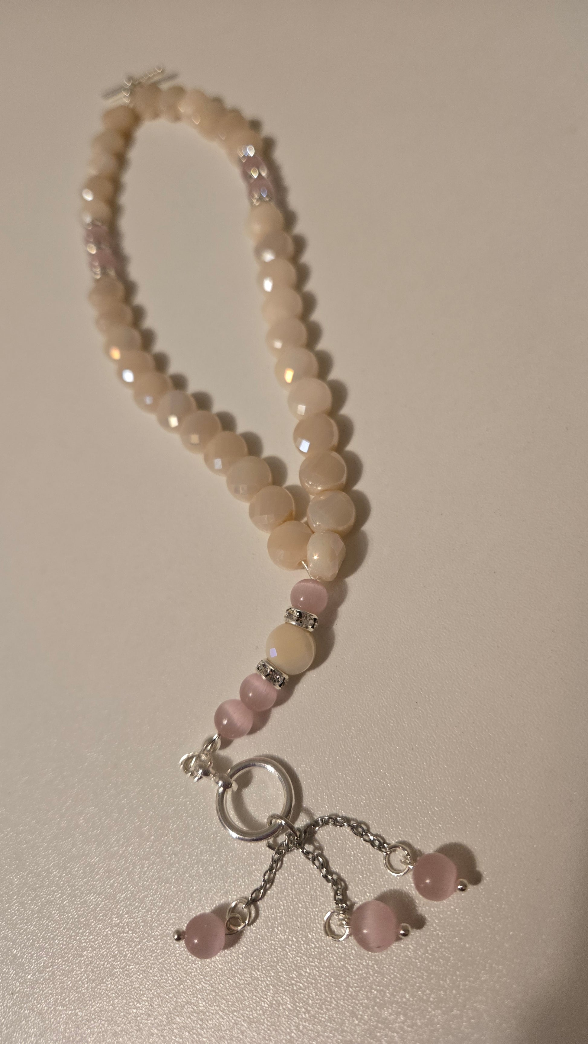 Rose Light Tasbih in a decorative pouch, ready for gifting
