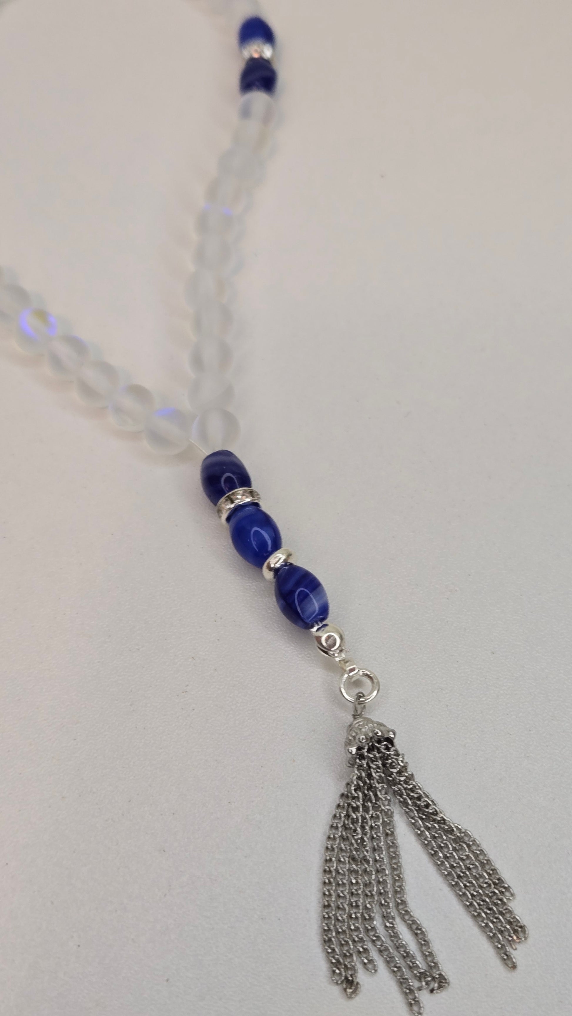 The Crystal Serenity Tasbih draped elegantly, showcasing its design