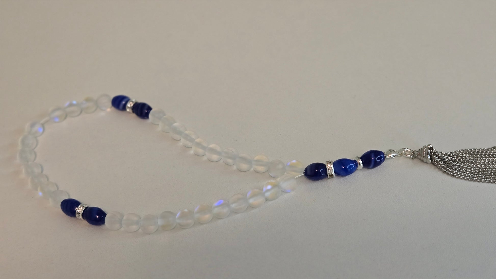 Elegant glass bead tasbih with clear and blue elements
