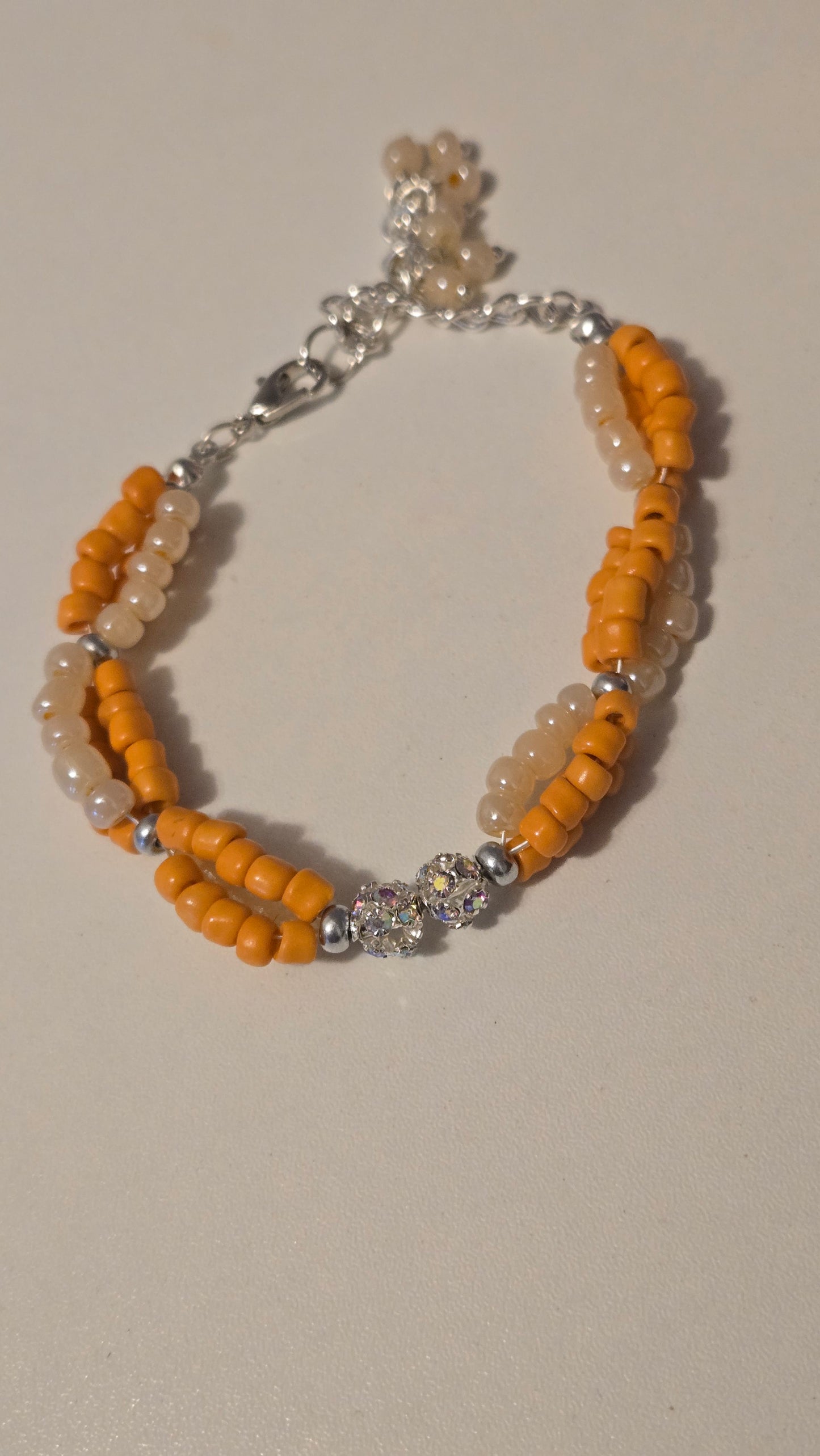 Handmade Coral Sun Bracelet displayed with complementary accessories, emphasizing its gift potential.