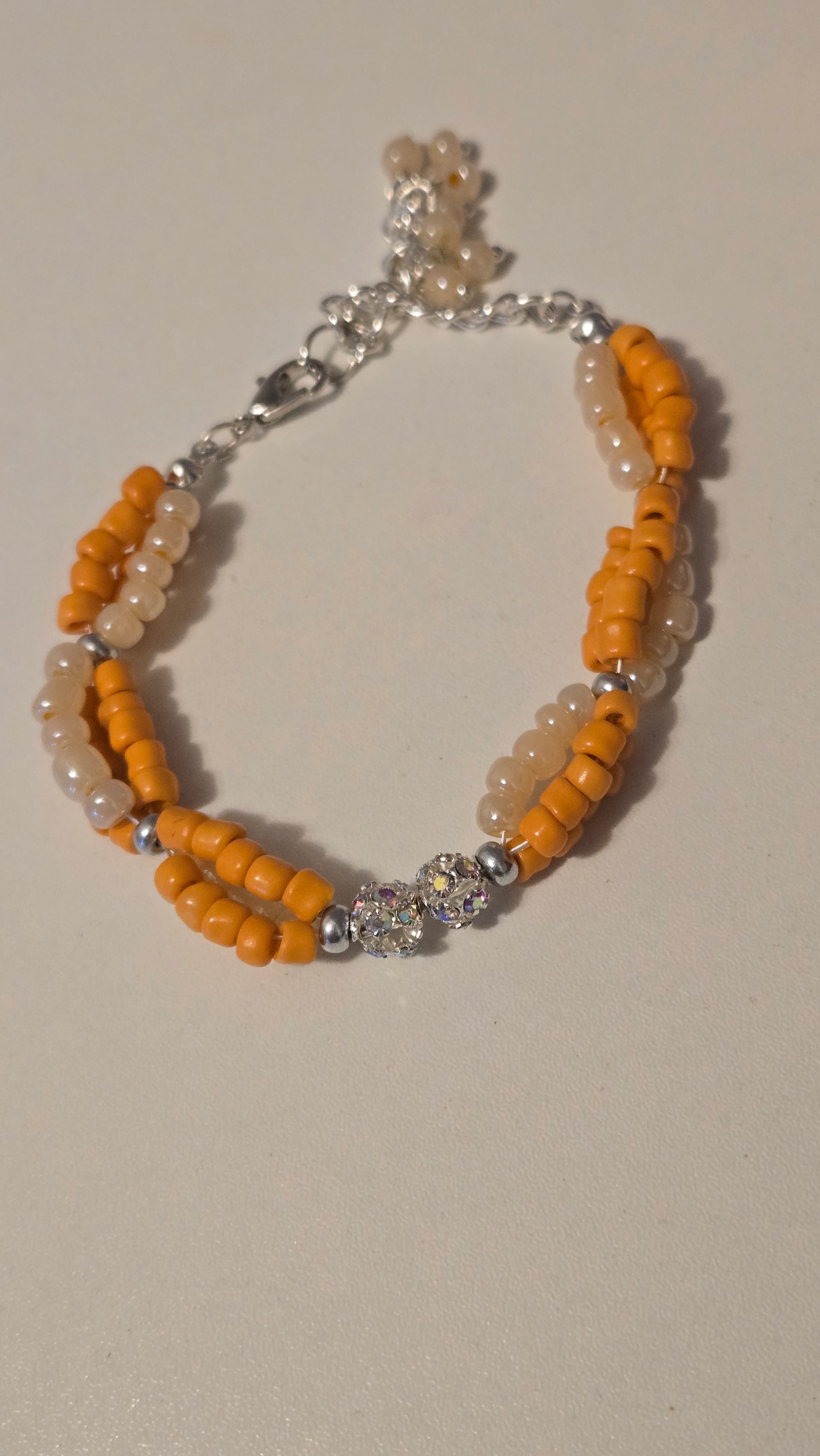 Handmade Coral Sun Bracelet displayed with complementary accessories, emphasizing its gift potential.