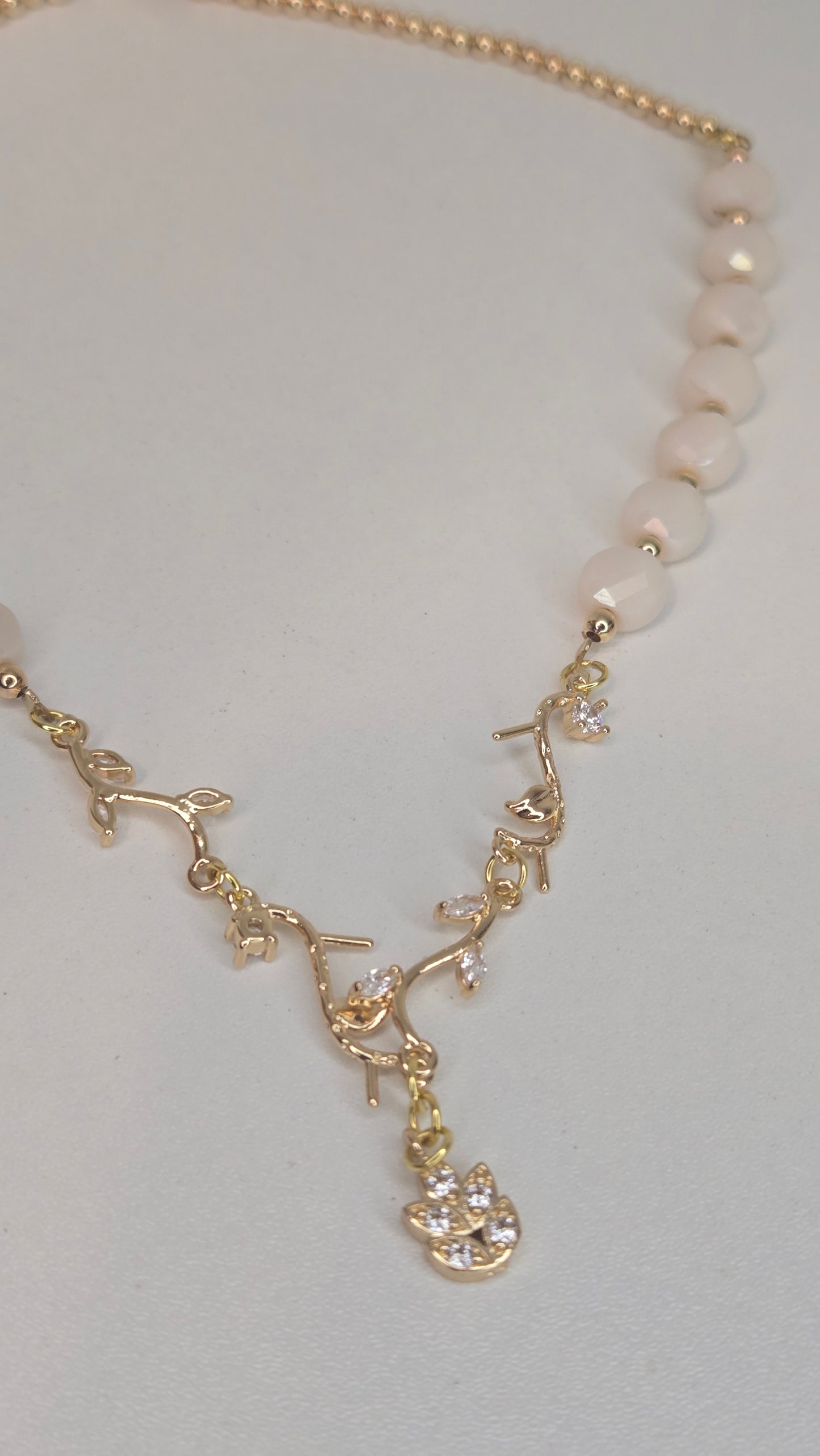 Pearl Branch Necklace showcasing sparkling stones and dangling charm