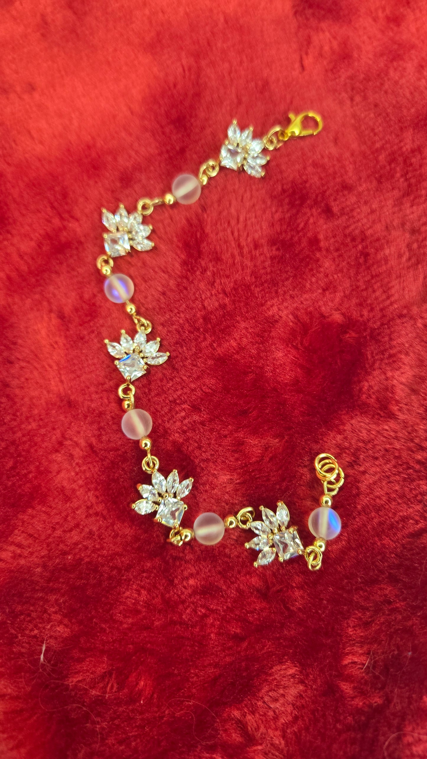 Model wearing the elegant Crystal Blossom handmade gold-tone bracelet on her wrist