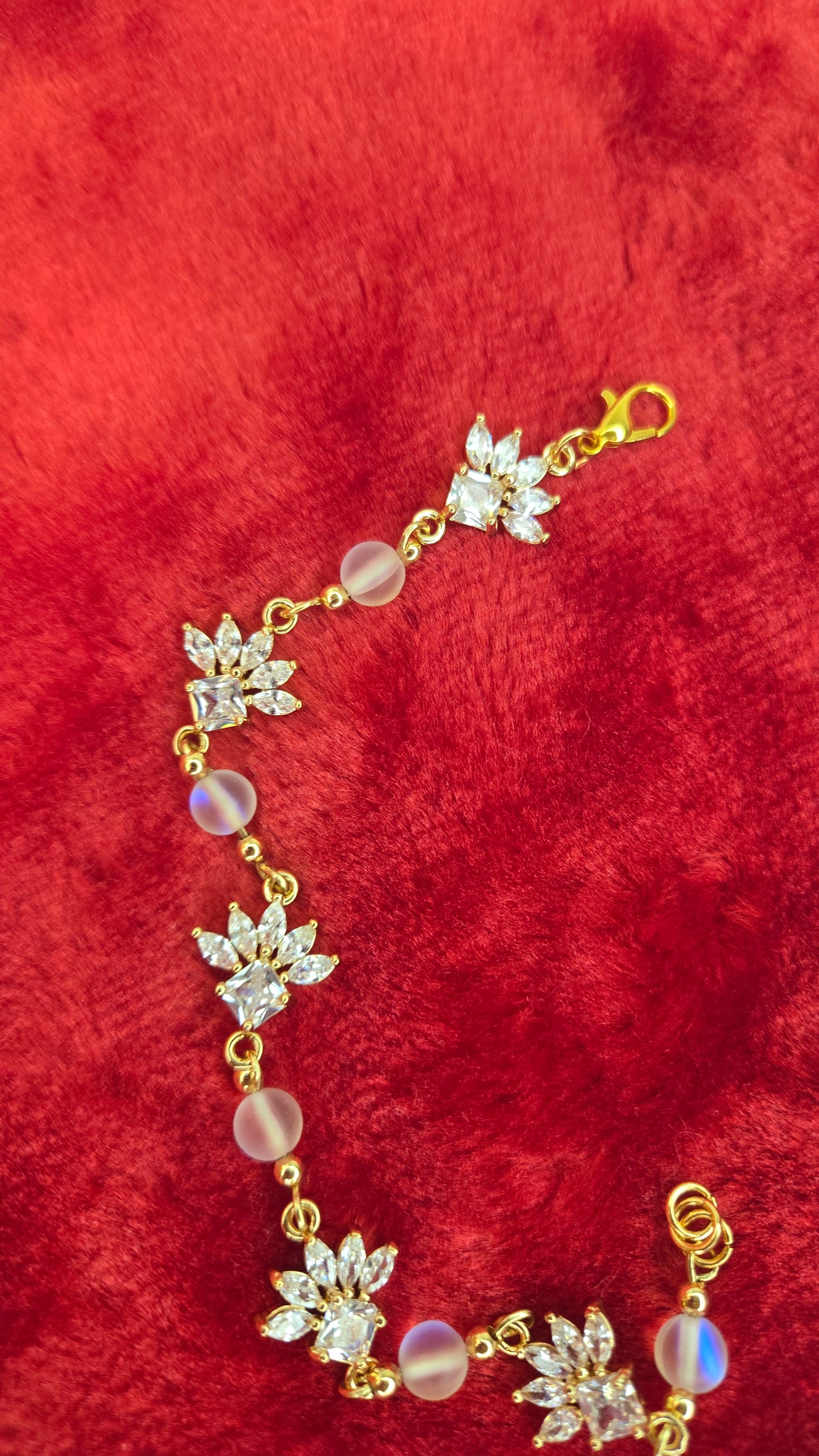 Detail shot of the unique crystal blossoms and soft iridescent glass beads on the bracelet