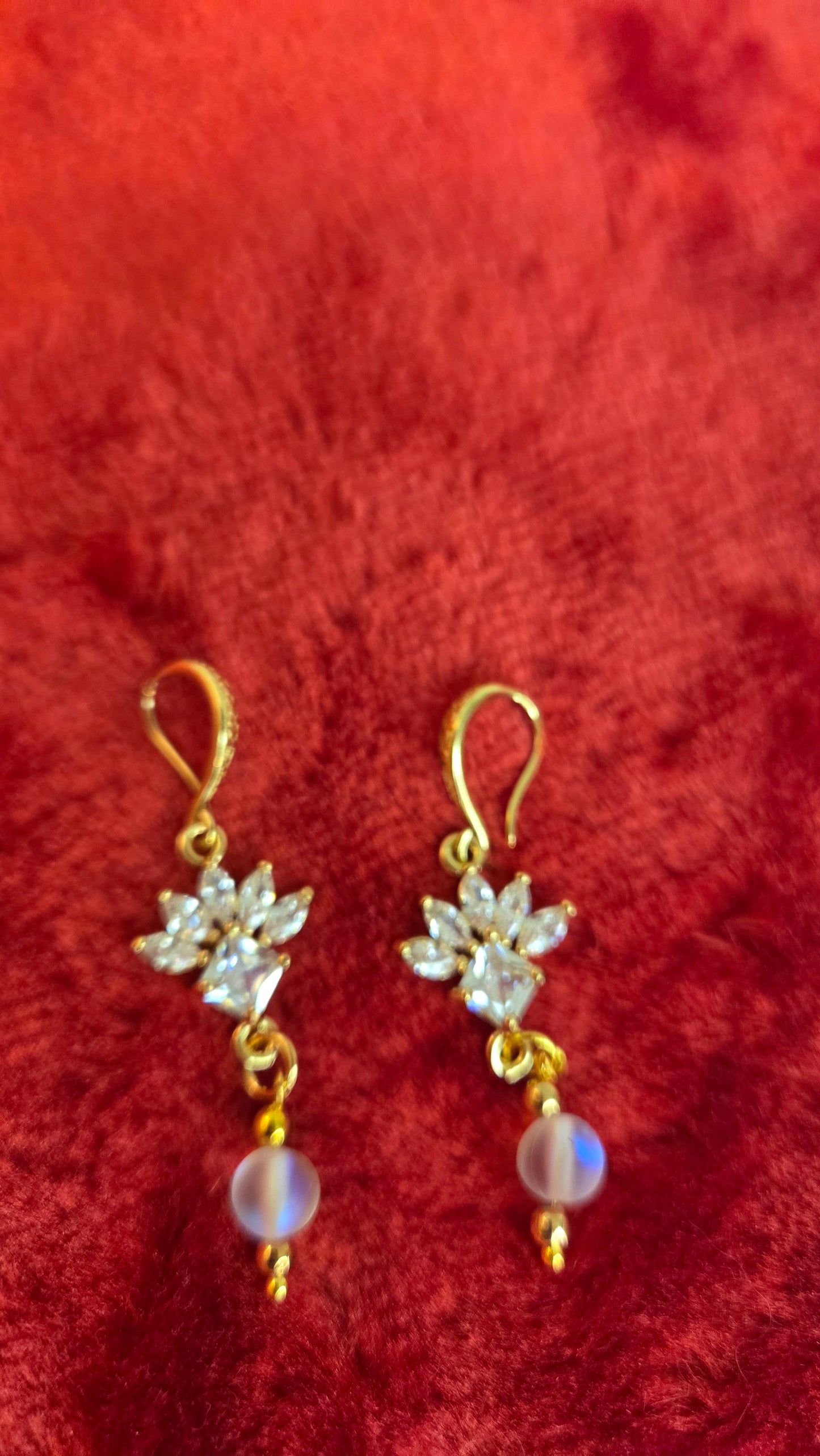 Model wearing elegant Golden Bloom Earrings, showcasing their sophisticated floral design.