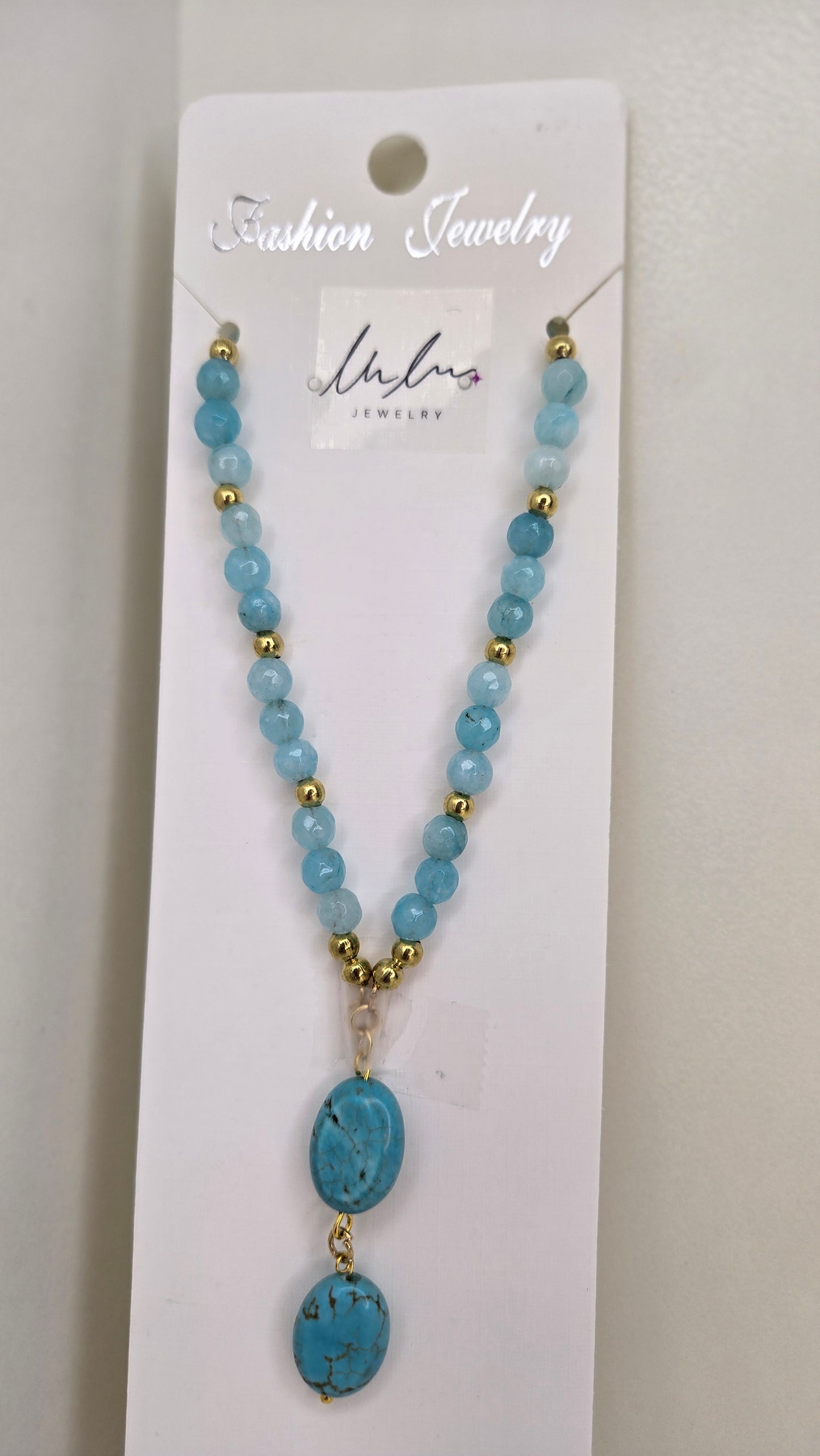 Handcrafted natural quartz necklace showcasing unique design and luxurious gold spacers