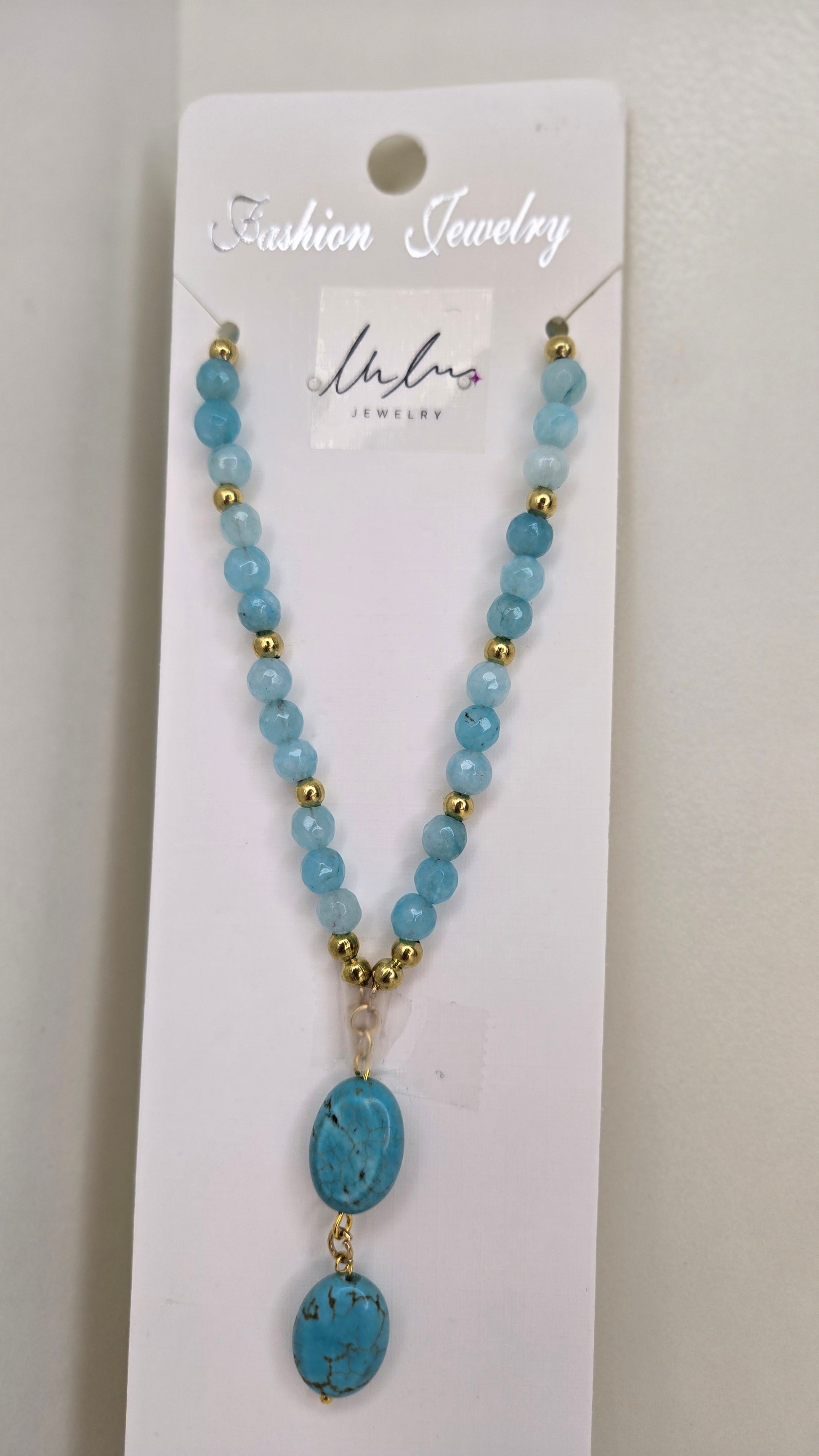Handcrafted natural quartz necklace showcasing unique design and luxurious gold spacers