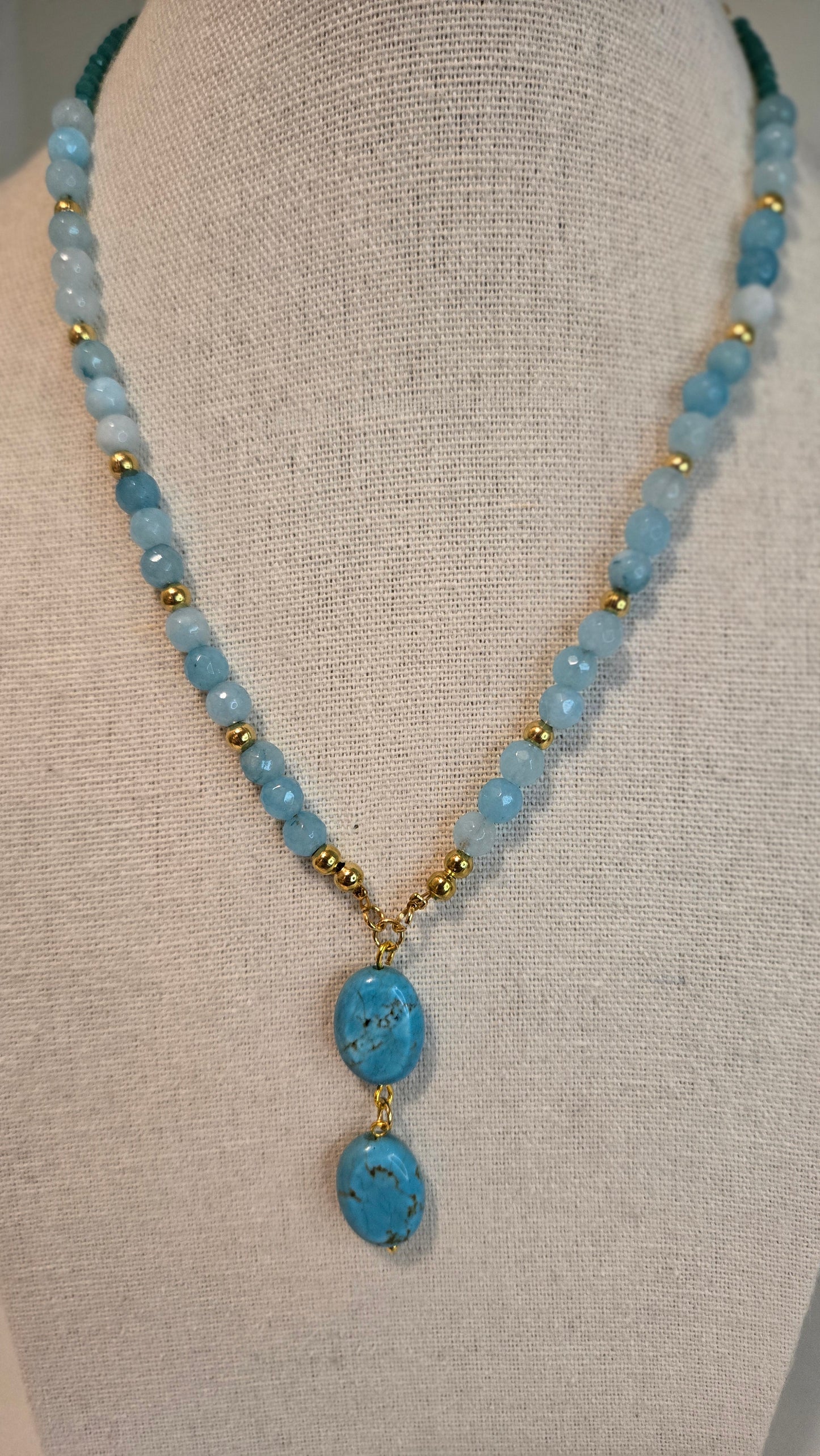 LuluTouch natural quartz necklace displayed on a jewelry stand, highlighting its elegance