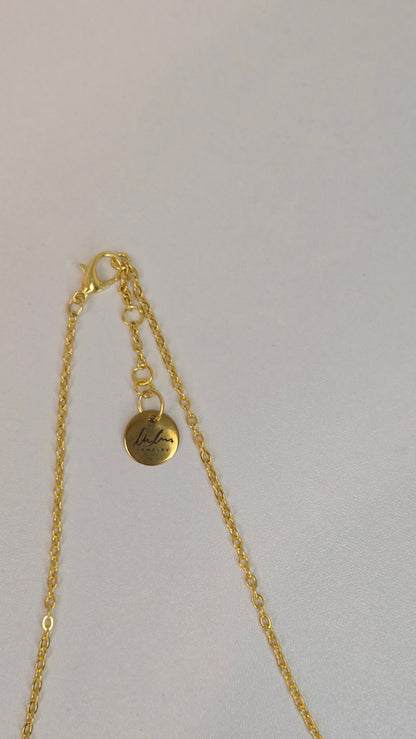 Pearl Blossom Gold-Tone Necklace with white bead accents and a floral centerpiece, view 2