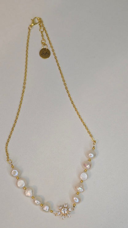 Pearl Blossom Gold-Tone Necklace with white bead accents and a floral centerpiece, view 3