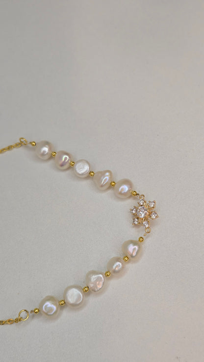 Pearl Blossom Gold-Tone Necklace with white bead accents and a floral centerpiece, view 5