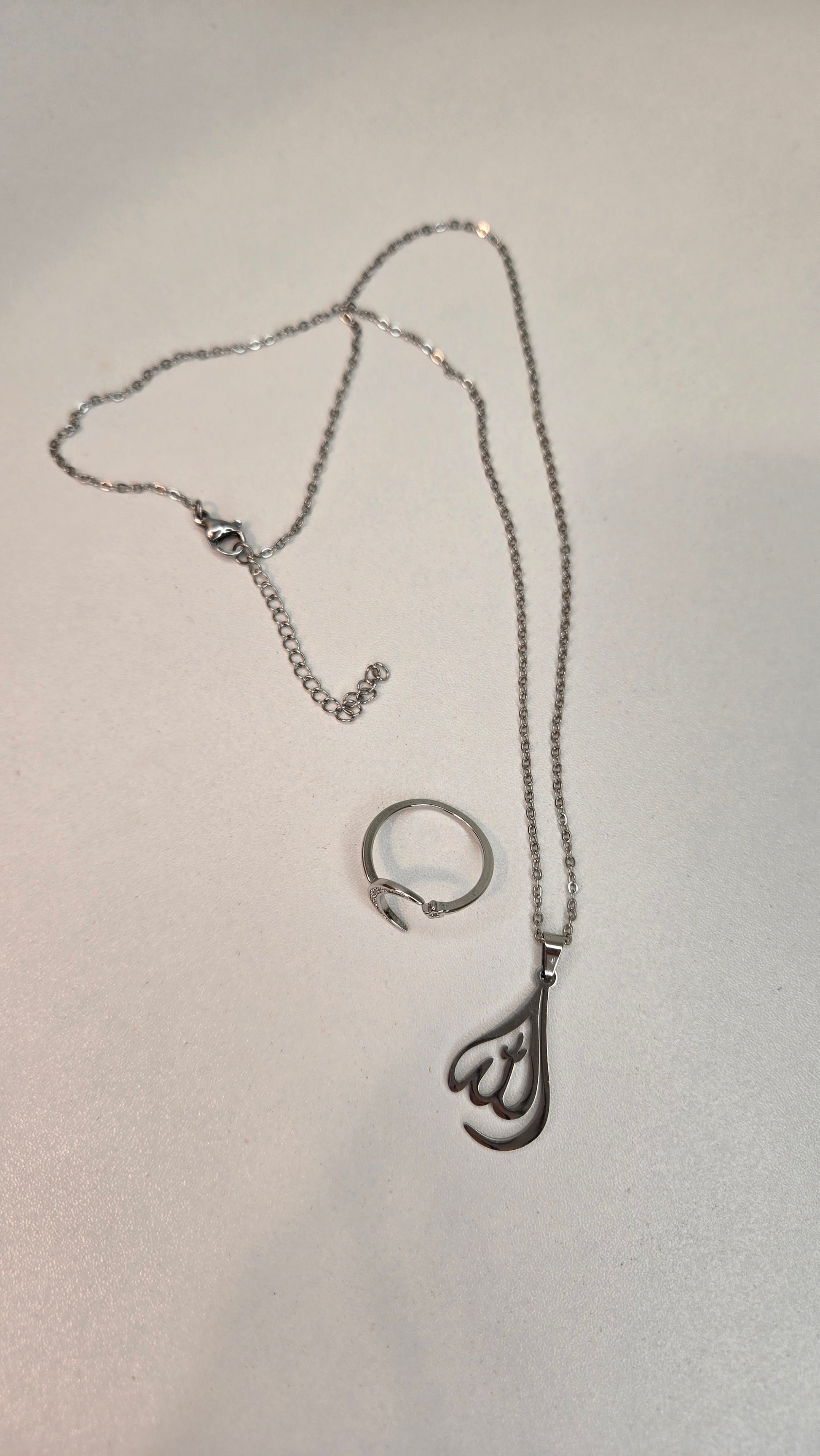 Model wearing a beautiful Allah necklace, showcasing its versatile style
