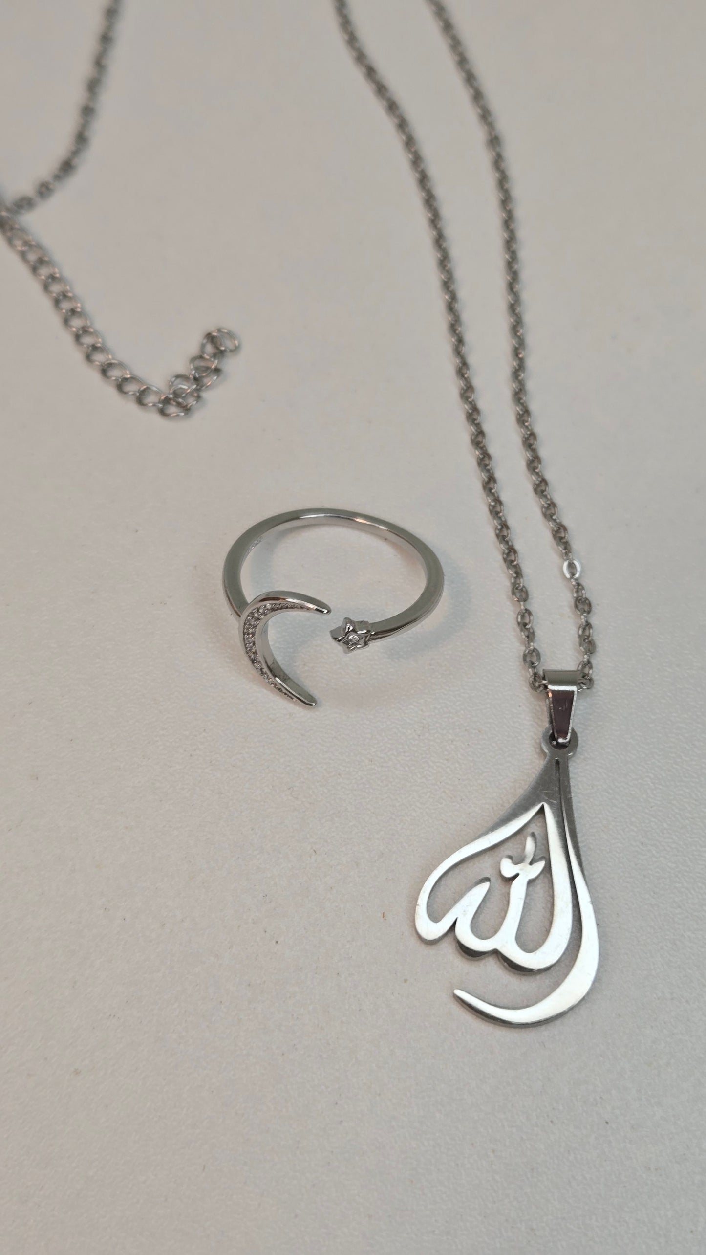 Handcrafted Allah pendant reflecting light, emphasizing its spiritual elegance
