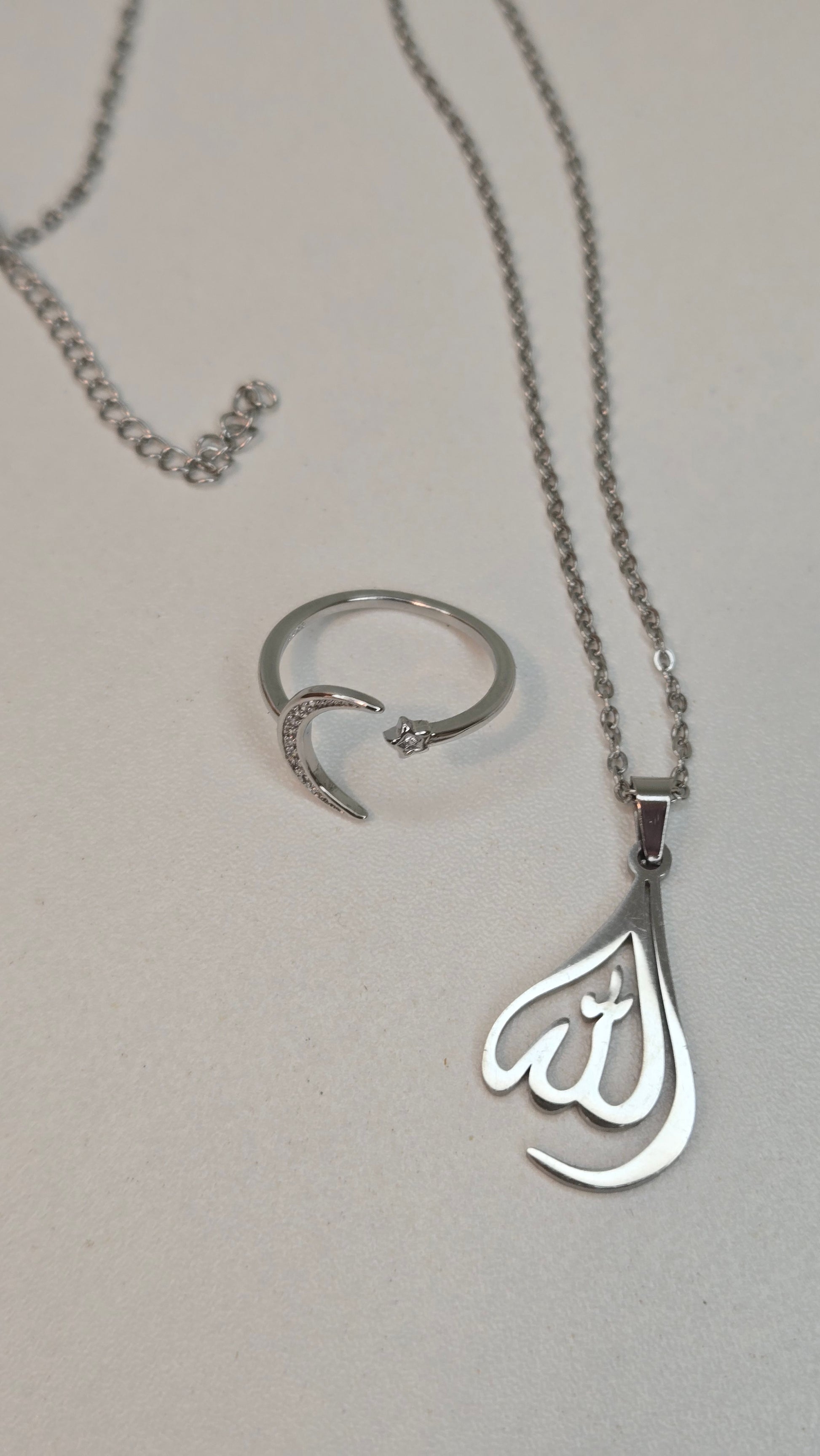 Handcrafted Allah pendant reflecting light, emphasizing its spiritual elegance