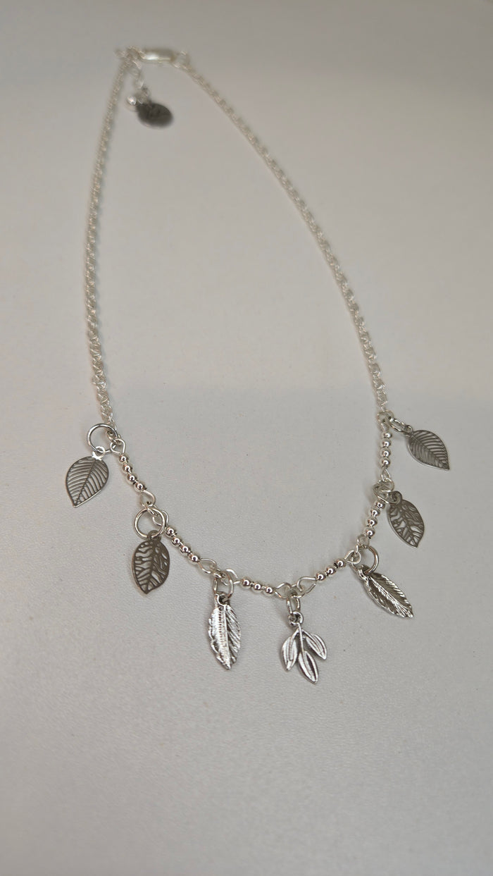 Silver Leaf Charm Necklace with leaf-shaped charms on a silver-tone chain
