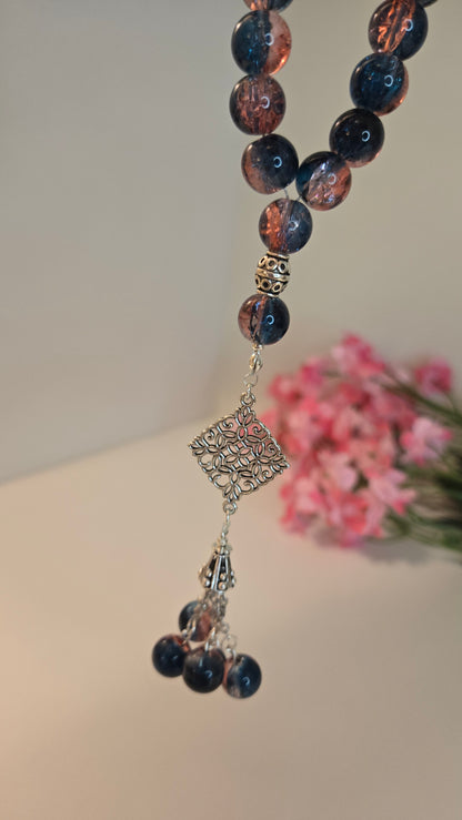 Midnight Bloom Prayer Beads with blue and rose marbled beads and an ornate charm, view 3