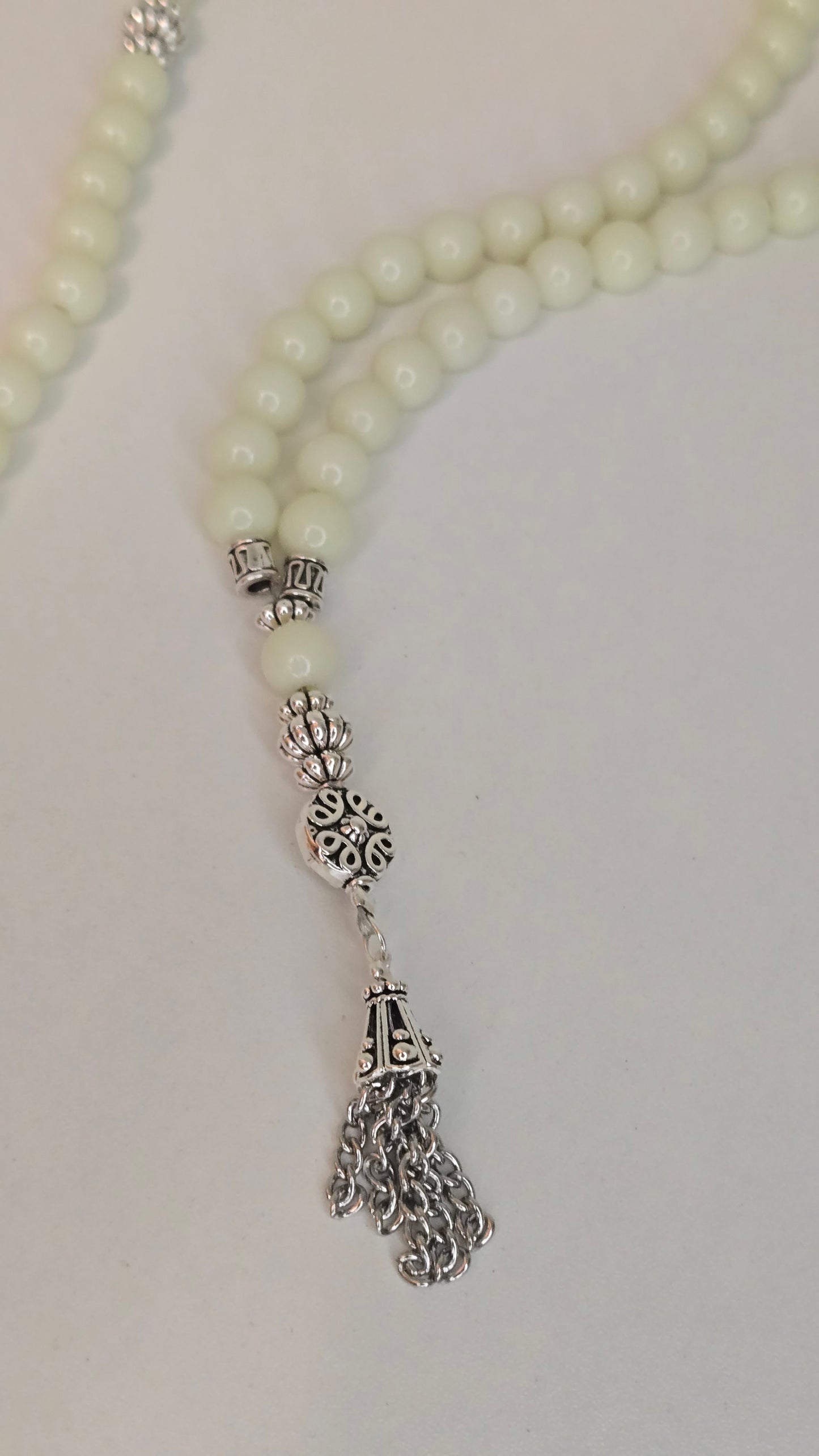 Luminous Glow Prayer Beads set against a serene background.