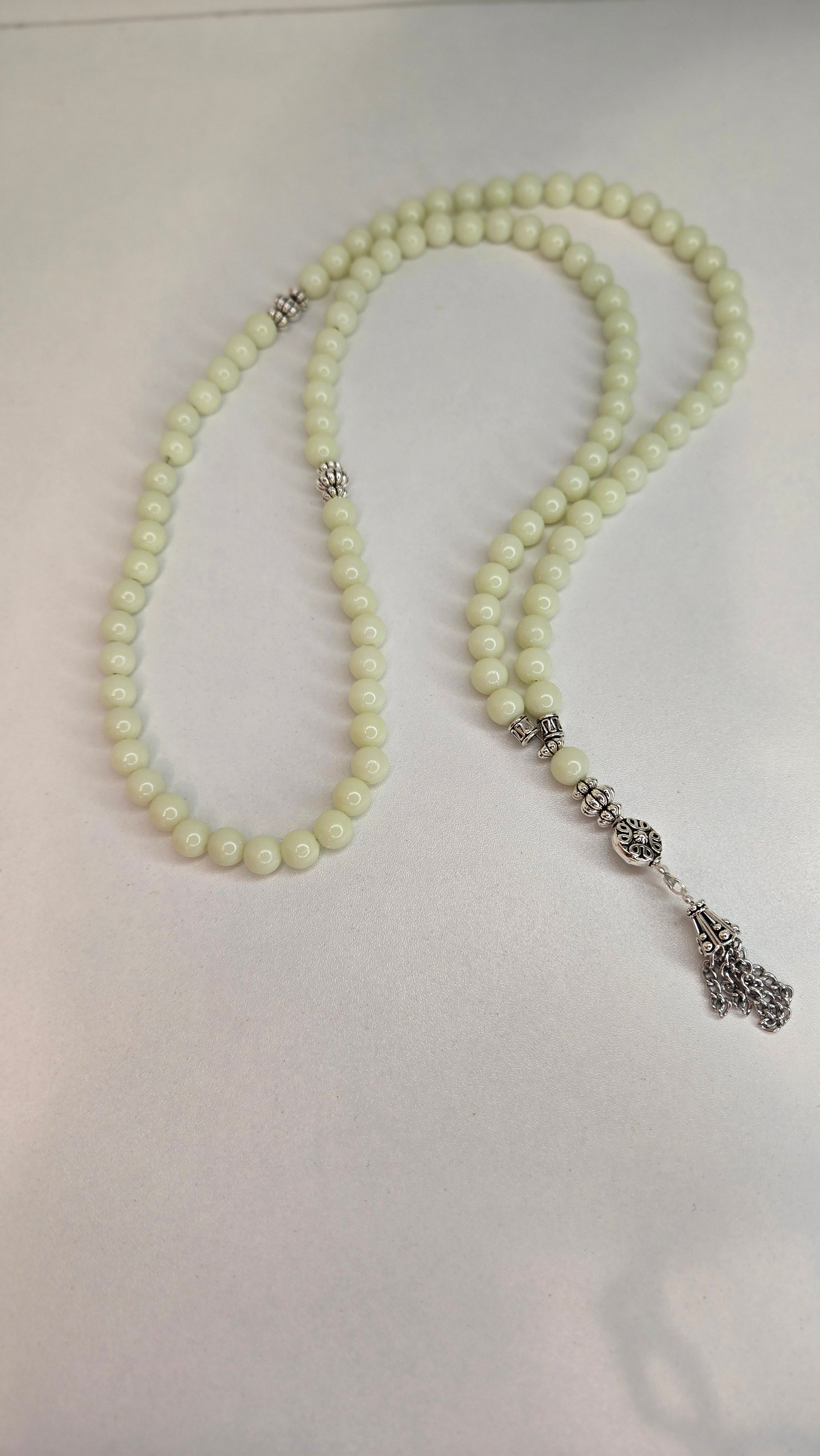 Artistic shot of Luminous Glow Prayer Beads in a yoga setting.