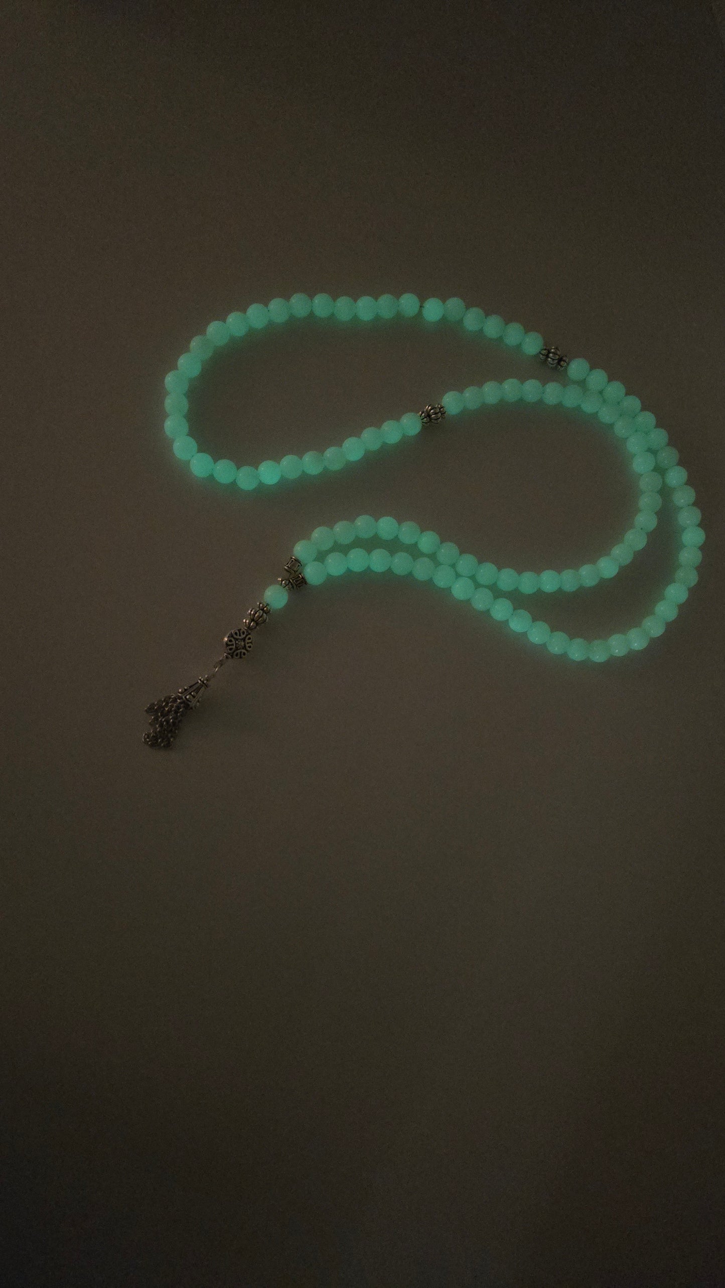 Elegant Luminous Glow Prayer Beads in a meditative practice.