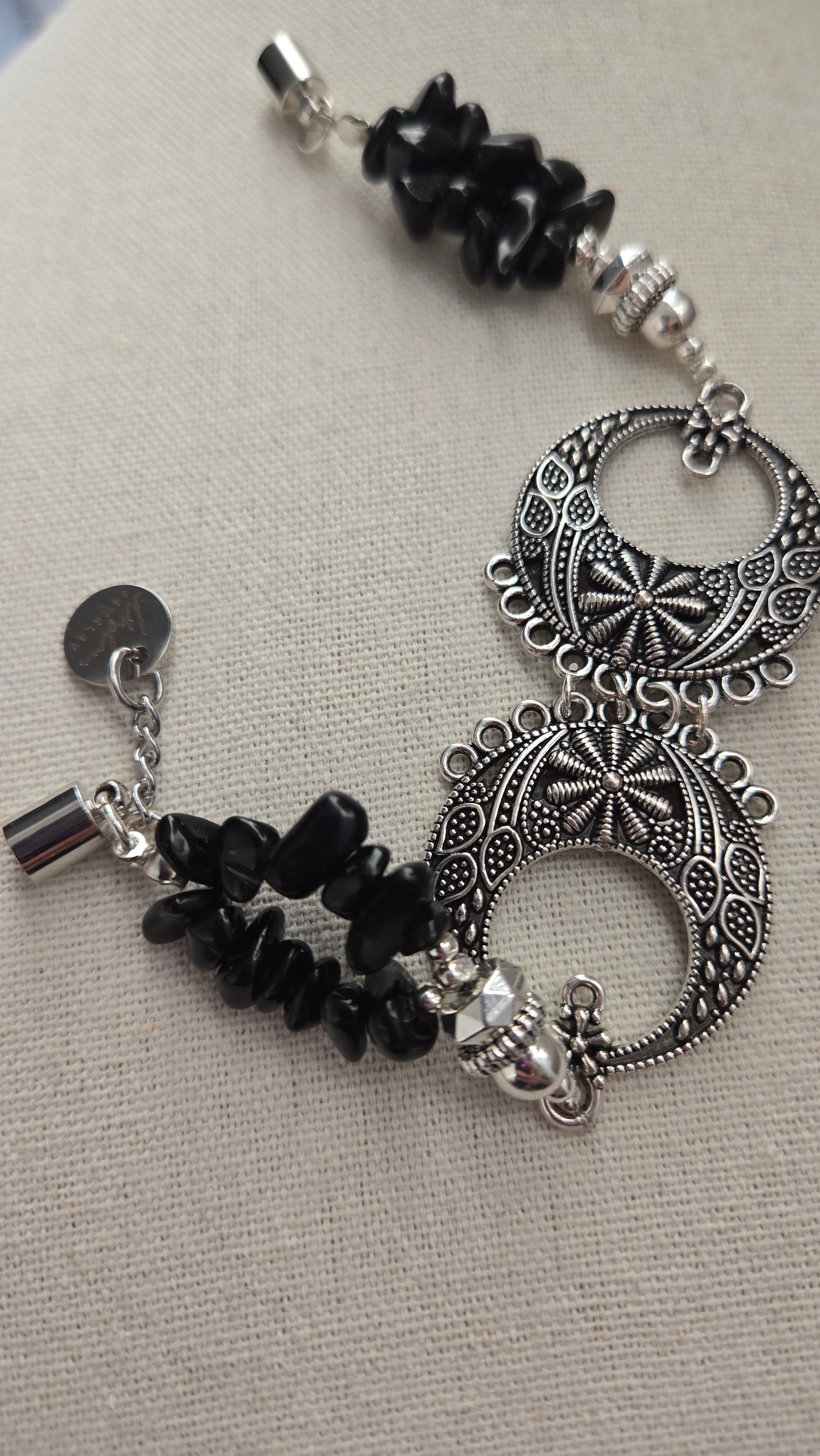 Detailed view of the lightweight magnetic clasp on the Black Moon Bracelet.