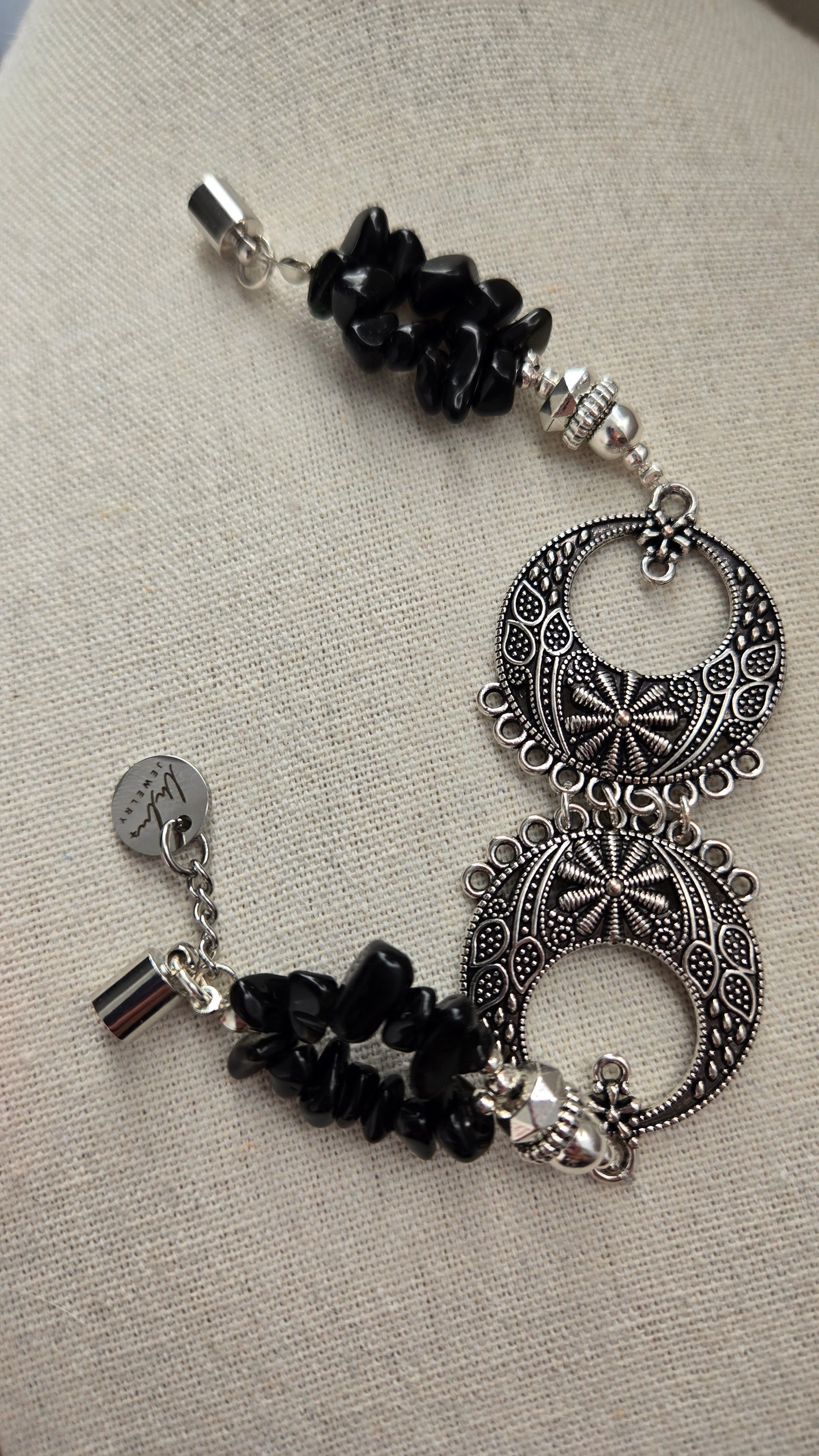 Black Moon Bracelet on a woman's wrist, highlighting the magnetic clasp.