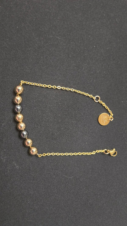 Mixed-Tone Bracelet with gold-tone chain, metallic beads and a round charm, view 3