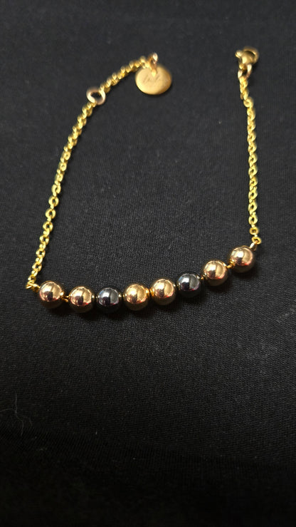 Mixed-Tone Bracelet with gold-tone chain, metallic beads and a round charm, view 5