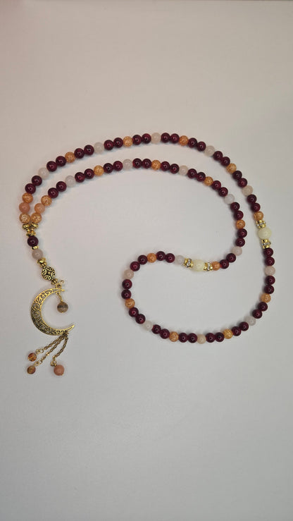Golden Sunset Tasbih with red, orange and cream beads and a gold-tone crescent moon charm, view 3