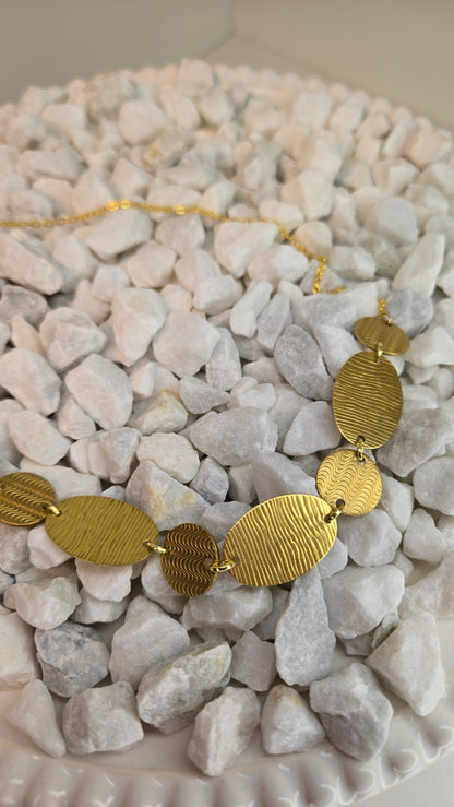 Golden Imprint Engraved Disc Necklace with an oval disc pendant on a gold-tone chain, view 5