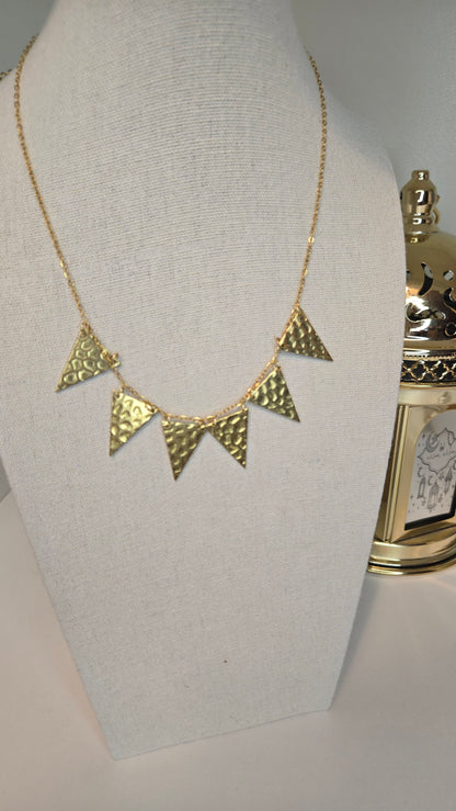 Golden Flames Necklace with hammered gold-plated triangle pendants on a chain