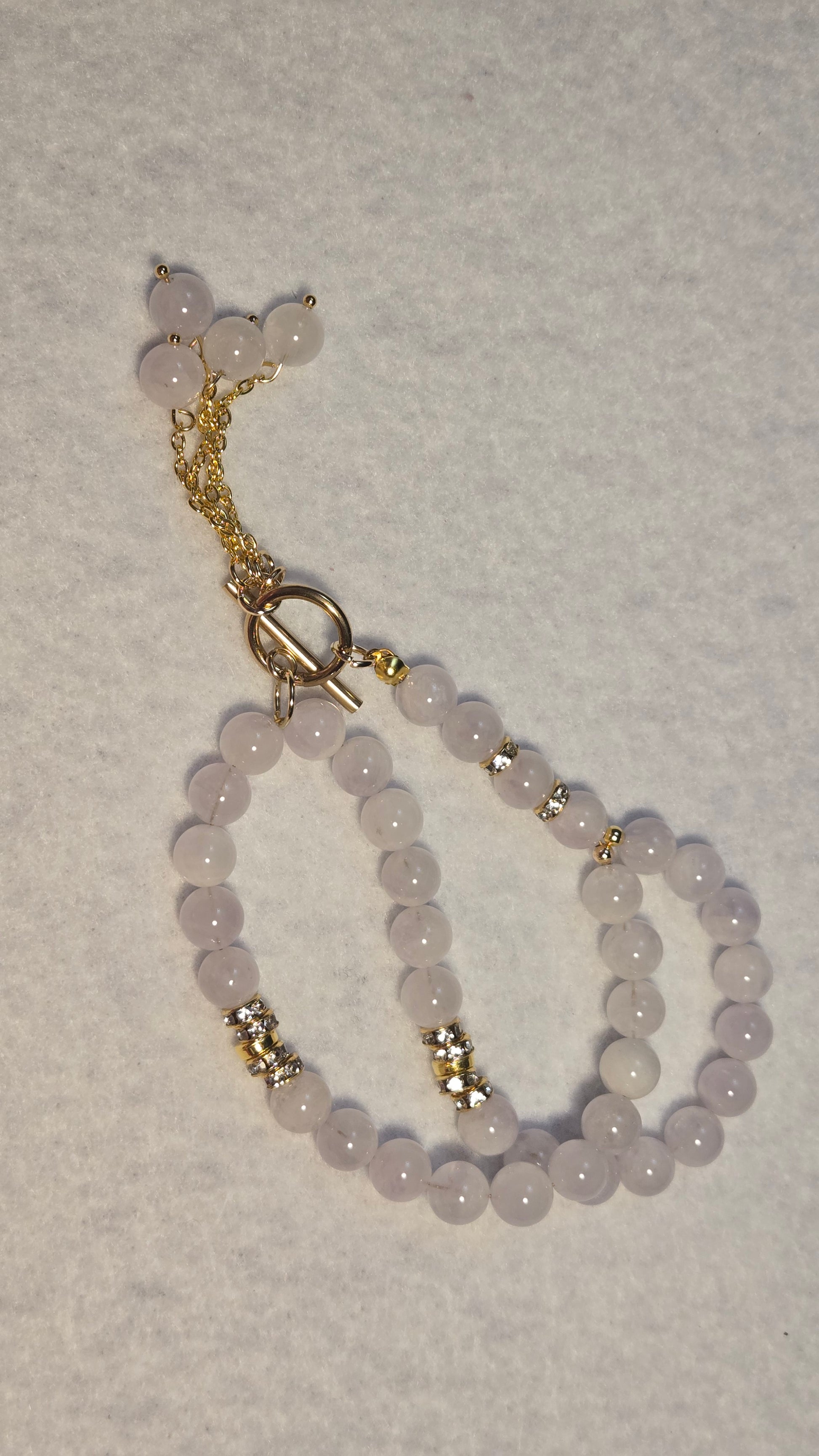 Woman wearing Amethyst Princess Tasbih as an elegant statement necklace, highlighting its versatile design.